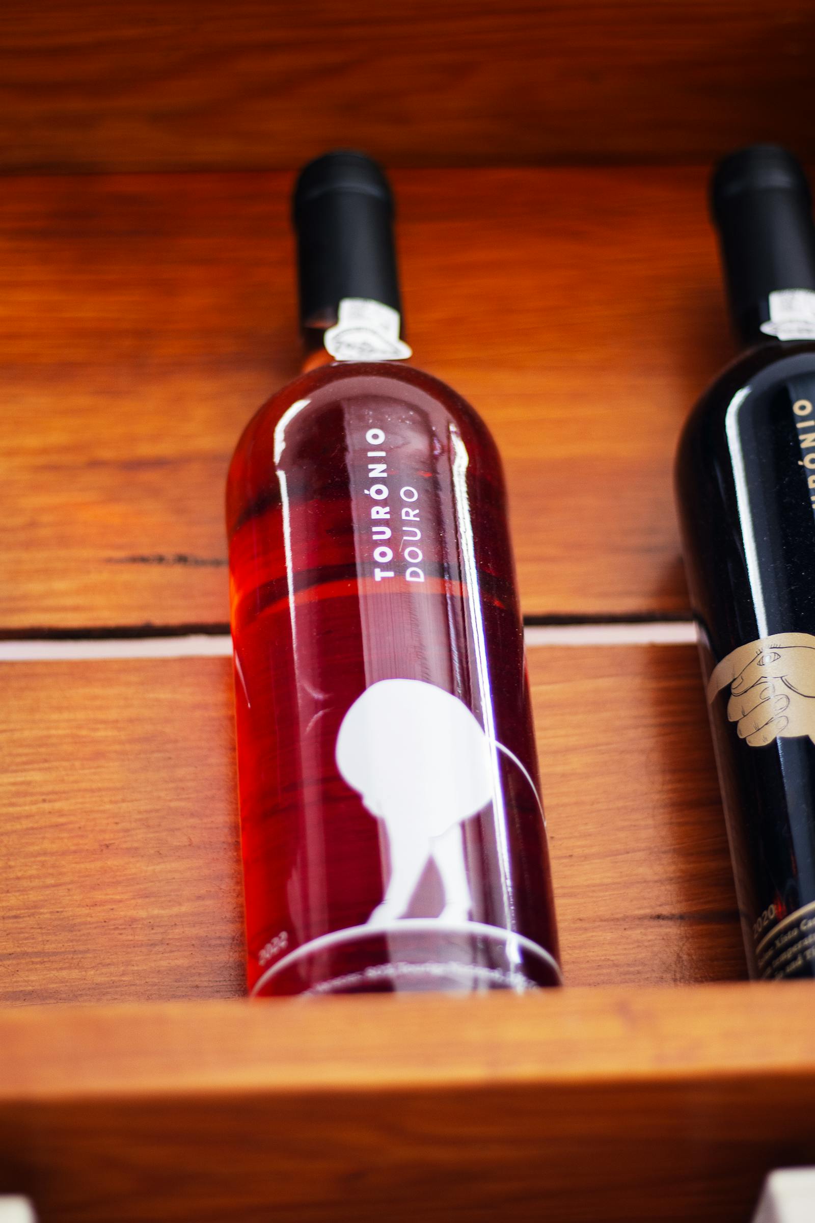 A library bottle of Vermora Reserva 2016 on a stone shelf.
